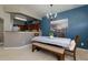 Charming dining area featuring a bench and chairs, complemented by a modern chandelier and accent wall at 2968 Oshields Sw Ct # 4, Marietta, GA 30060