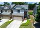 Charming townhome with a two-car garage, brick accents and a neatly landscaped front yard at 2968 Oshields Sw Ct # 4, Marietta, GA 30060