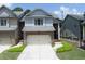 Charming townhome with a two-car garage, brick accents and a neatly landscaped front yard at 2968 Oshields Sw Ct # 4, Marietta, GA 30060