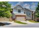 Charming townhome with a two-car garage, brick accents and a neatly landscaped front yard at 2968 Oshields Sw Ct # 4, Marietta, GA 30060