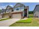 Charming townhome with a two-car garage, brick accents and a neatly landscaped front yard at 2968 Oshields Sw Ct # 4, Marietta, GA 30060
