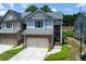 Charming townhome with a two-car garage, brick accents and a neatly landscaped front yard at 2968 Oshields Sw Ct # 4, Marietta, GA 30060
