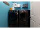 Laundry room with side-by-side modern black washer and dryer units at 2968 Oshields Sw Ct # 4, Marietta, GA 30060