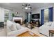 Cozy living room with a fireplace, comfortable seating, and a ceiling fan for a relaxing ambiance at 2968 Oshields Sw Ct # 4, Marietta, GA 30060