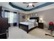 Spacious main bedroom with a ceiling fan, dark wood furniture, and neutral walls for serene comfort at 2968 Oshields Sw Ct # 4, Marietta, GA 30060