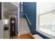 Inviting staircase with a window, leading to upper levels with natural light and architectural detail at 2968 Oshields Sw Ct # 4, Marietta, GA 30060