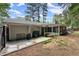 Spacious backyard featuring a patio area, lush greenery, and a privacy fence, perfect for outdoor activities at 1467 Hewatt Rd, Lilburn, GA 30047