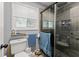 Bright bathroom with a modern glass-enclosed shower and fixtures at 1467 Hewatt Rd, Lilburn, GA 30047
