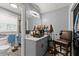 Bathroom with a vessel sink, modern fixtures, and built-in storage at 1467 Hewatt Rd, Lilburn, GA 30047