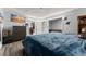 Well-lit bedroom with hardwood floors, soft lighting, and a closet providing ample storage at 1467 Hewatt Rd, Lilburn, GA 30047