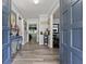 Inviting entryway with blue doors and grey wood-look flooring at 1467 Hewatt Rd, Lilburn, GA 30047