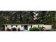 Charming single-story home with attached garage, black shutters, and mature landscaping at 1467 Hewatt Rd, Lilburn, GA 30047