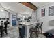 Modern kitchen with gray cabinets, a breakfast bar and stainless steel appliances at 1467 Hewatt Rd, Lilburn, GA 30047