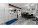 Open kitchen and dining area with grey cabinets and a view of the backyard at 1467 Hewatt Rd, Lilburn, GA 30047