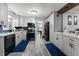 Stylish kitchen with grey cabinets, modern appliances, and trendy countertops at 1467 Hewatt Rd, Lilburn, GA 30047