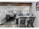 Open concept kitchen with bar seating and a dining area, perfect for entertaining guests at 1467 Hewatt Rd, Lilburn, GA 30047
