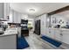 Bright kitchen featuring grey cabinetry, modern appliances, and sleek countertops at 1467 Hewatt Rd, Lilburn, GA 30047