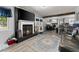 Spacious living room with fireplace and views of the open concept kitchen and dining areas at 1467 Hewatt Rd, Lilburn, GA 30047
