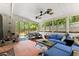 Inviting screened porch with ample seating, ideal for relaxation and enjoying the outdoor views at 1467 Hewatt Rd, Lilburn, GA 30047