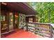 Exterior balcony with stone accents and wooded views at 2016 Castleway Ne Dr, Atlanta, GA 30345