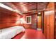 Bedroom with wood paneling, a single bed, and closet at 2016 Castleway Ne Dr, Atlanta, GA 30345