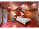 Bedroom with wood paneling, wood ceiling, and unique architectural design at 2016 Castleway Ne Dr, Atlanta, GA 30345