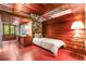 Comfortable bedroom with desk, single bed, and wood accents at 2016 Castleway Ne Dr, Atlanta, GA 30345