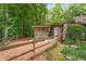 Architectural house exterior with stone and wood design with enclosed area at 2016 Castleway Ne Dr, Atlanta, GA 30345