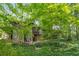 Stone and wood exterior with ivy-covered ground and surrounding trees at 2016 Castleway Ne Dr, Atlanta, GA 30345