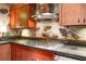 Kitchen featuring stainless steel appliances, wooden cabinets, and stone accents at 2016 Castleway Ne Dr, Atlanta, GA 30345