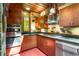 Well-equipped kitchen featuring stainless steel appliances, wood cabinets, and stone accents at 2016 Castleway Ne Dr, Atlanta, GA 30345