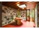 Cozy sunroom with natural stone walls, wood ceiling with skylight, and plenty of natural light at 2016 Castleway Ne Dr, Atlanta, GA 30345