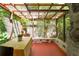 Bright and airy sunroom with a wood framed glass roof and stone accents at 2016 Castleway Ne Dr, Atlanta, GA 30345
