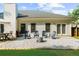 Backyard patio features a grill, ample seating, and lush green lawn at 7610 Golden Sands Dr, Cumming, GA 30041