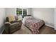 Bedroom featuring comfortable seating, soft carpeting, and a well-lit space with a calming ambiance at 7610 Golden Sands Dr, Cumming, GA 30041