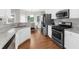 Modern kitchen featuring stainless steel appliances and granite countertops at 7610 Golden Sands Dr, Cumming, GA 30041