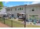Expansive view of the fenced backyard, featuring a well-manicured lawn, patio area and exterior view of the home at 146 Bellehaven Dr, Woodstock, GA 30188