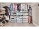 Spacious walk in closet featuring shelving units with storage and clothing racks at 146 Bellehaven Dr, Woodstock, GA 30188