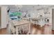 Bright and airy dining room with hardwood floors, chandelier, and open floor plan at 146 Bellehaven Dr, Woodstock, GA 30188