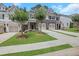 Charming townhomes feature stone accents, attached garages, and manicured front lawns at 146 Bellehaven Dr, Woodstock, GA 30188