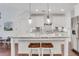 Modern kitchen with granite countertops, stainless steel appliances, and seating at the island at 146 Bellehaven Dr, Woodstock, GA 30188