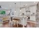 Open-concept kitchen with a center island, stainless steel appliances, and hardwood floors at 146 Bellehaven Dr, Woodstock, GA 30188