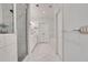 Modern main bathroom featuring glass shower, double sink vanity, and elegant finishes for a spa-like experience at 146 Bellehaven Dr, Woodstock, GA 30188