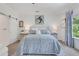 Well-lit main bedroom featuring a comfortable bed, and stylish decor at 146 Bellehaven Dr, Woodstock, GA 30188