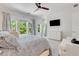 Bright main bedroom with natural light, comfortable bed, TV and stylish decor at 146 Bellehaven Dr, Woodstock, GA 30188