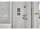 Modern shower featuring white tiled walls, a showerhead, and built-in shelves at 146 Bellehaven Dr, Woodstock, GA 30188