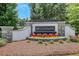 Elegant BELLEHAVEN community entrance sign surrounded by colorful flowers and landscaped grounds at 146 Bellehaven Dr, Woodstock, GA 30188