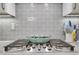Close up of stainless steel gas stove with granite backsplash at 146 Bellehaven Dr, Woodstock, GA 30188