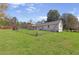 Spacious backyard with a well-maintained lawn and chain-link fence, perfect for outdoor activities and relaxation at 3556 Riley Rd, Douglasville, GA 30134