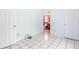 Cozy bedroom with tile floors, open closet, and doorway at 3556 Riley Rd, Douglasville, GA 30134